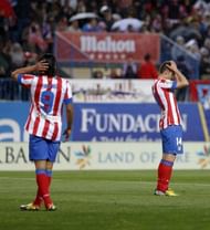 Atletico Madrid midfielder Gabi (R) and forward Radamel Falcao saw their side beaten 2-1 by Real on April 27, 2013
